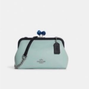 CUTE Coach crossbody bag. Baby blue with blueberry closure.